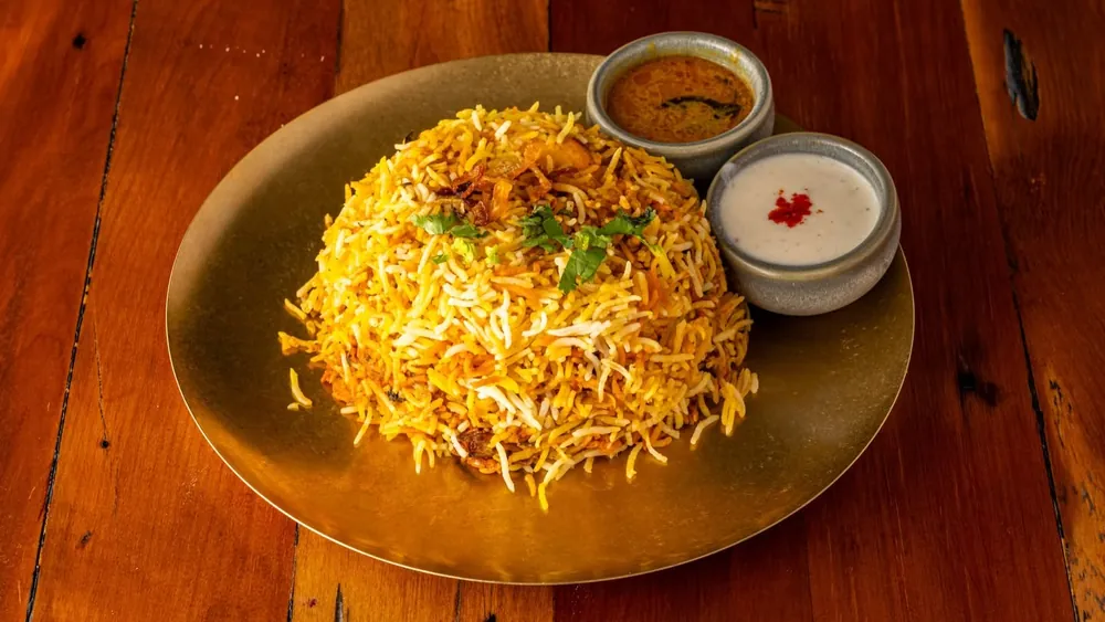 Hyderabadi chicken biryani with raita and salan