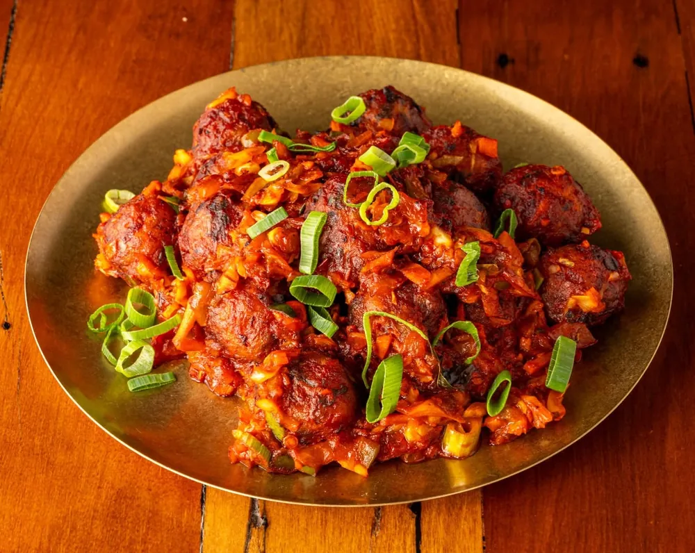 Chilli chicken topped with spring onion